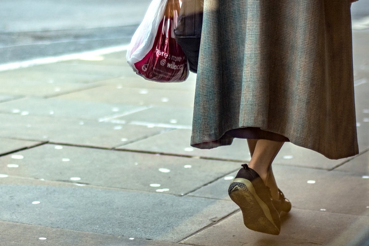 Woman walking along the street