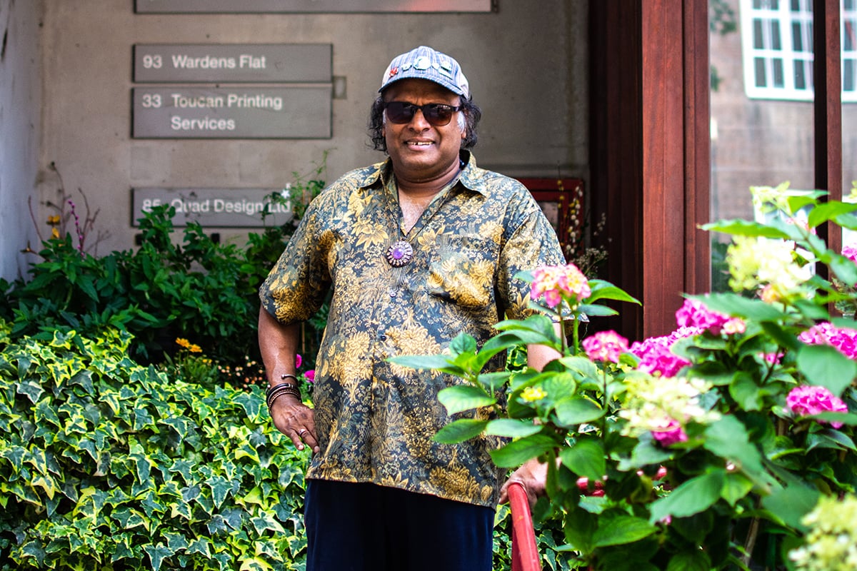 Older man standing in garden