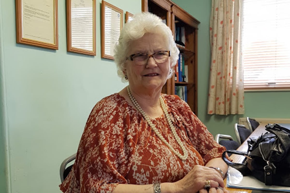 Photo of Diana by a desk