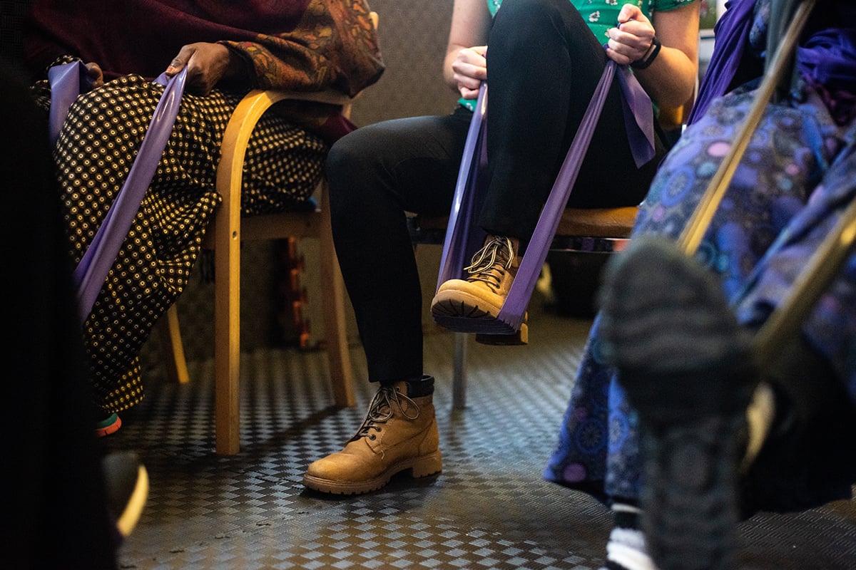 A person using a resistance band with their foot