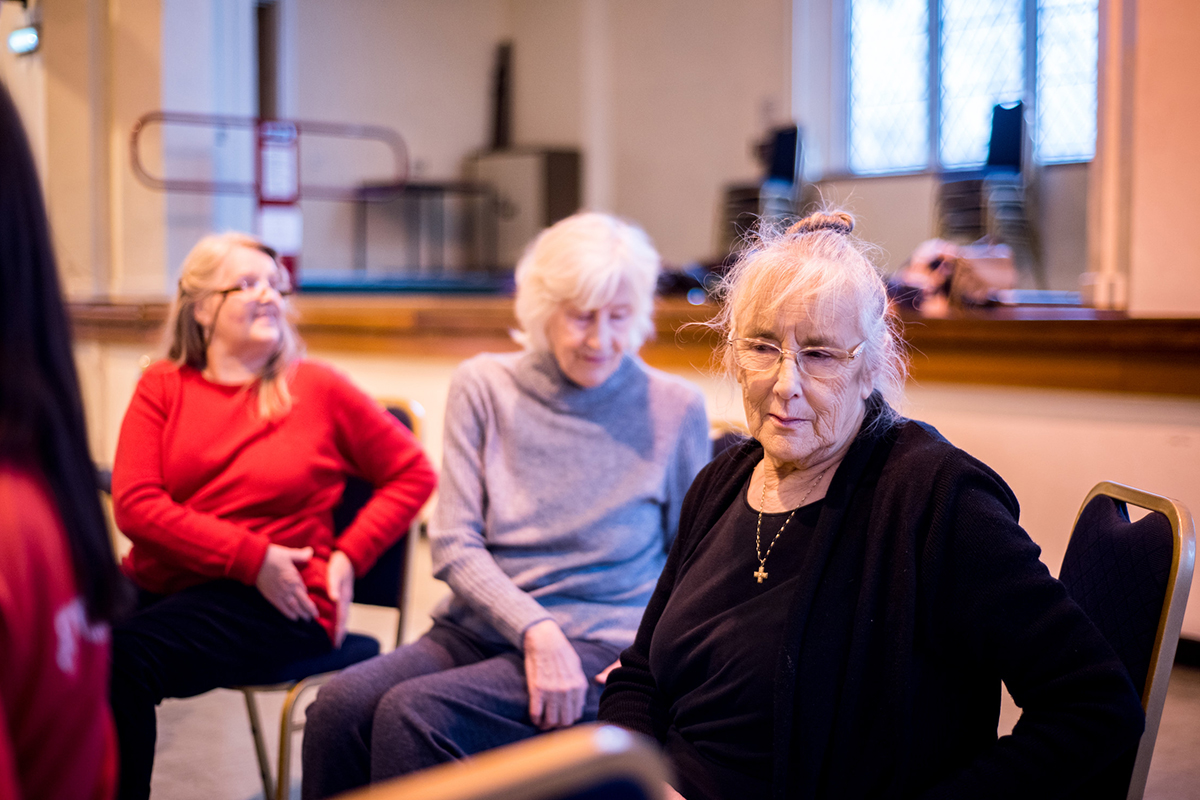 Valerie an older woman sitting on a chair