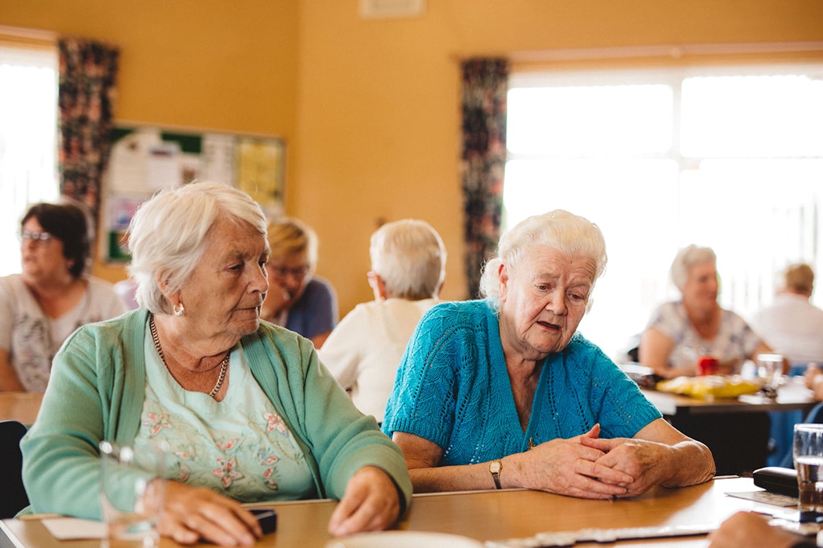 Older people playing dominoes