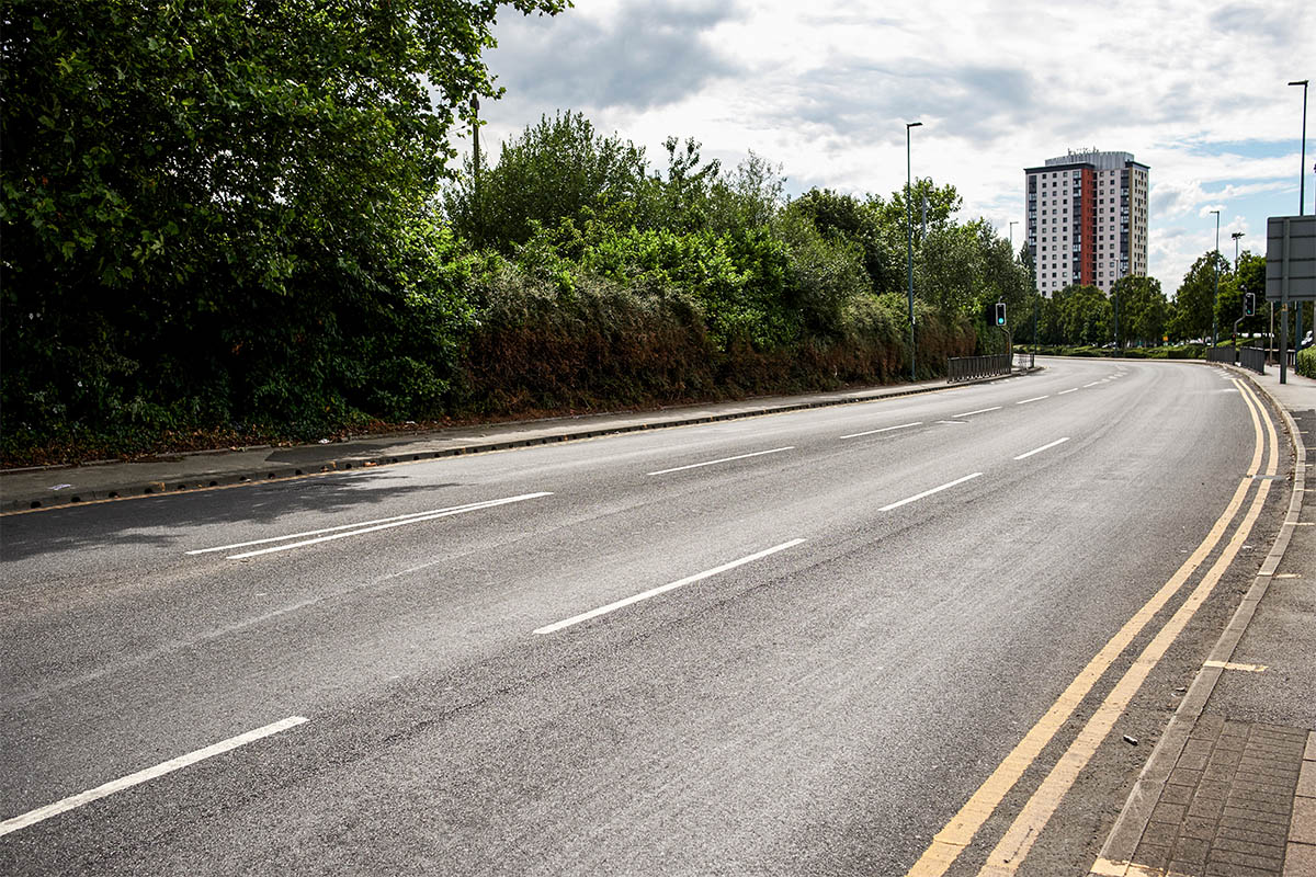an urban road disappearing into the distance