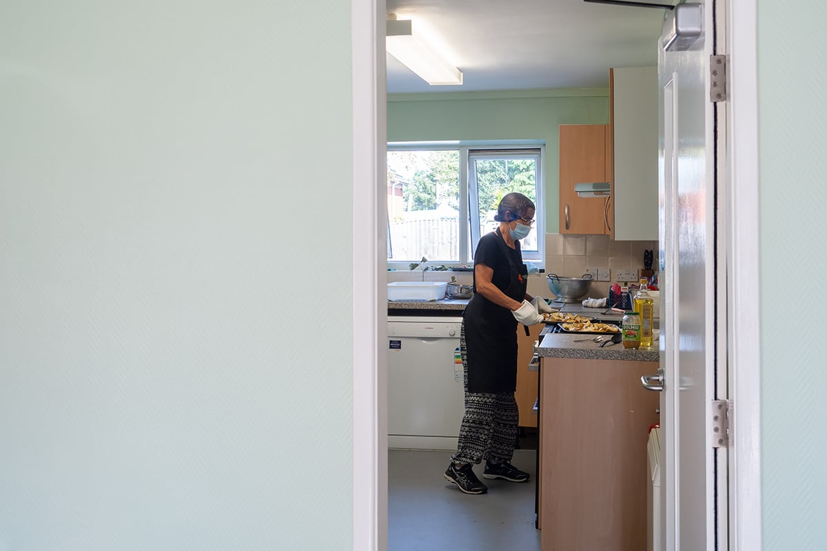 Older woman in community kitchen