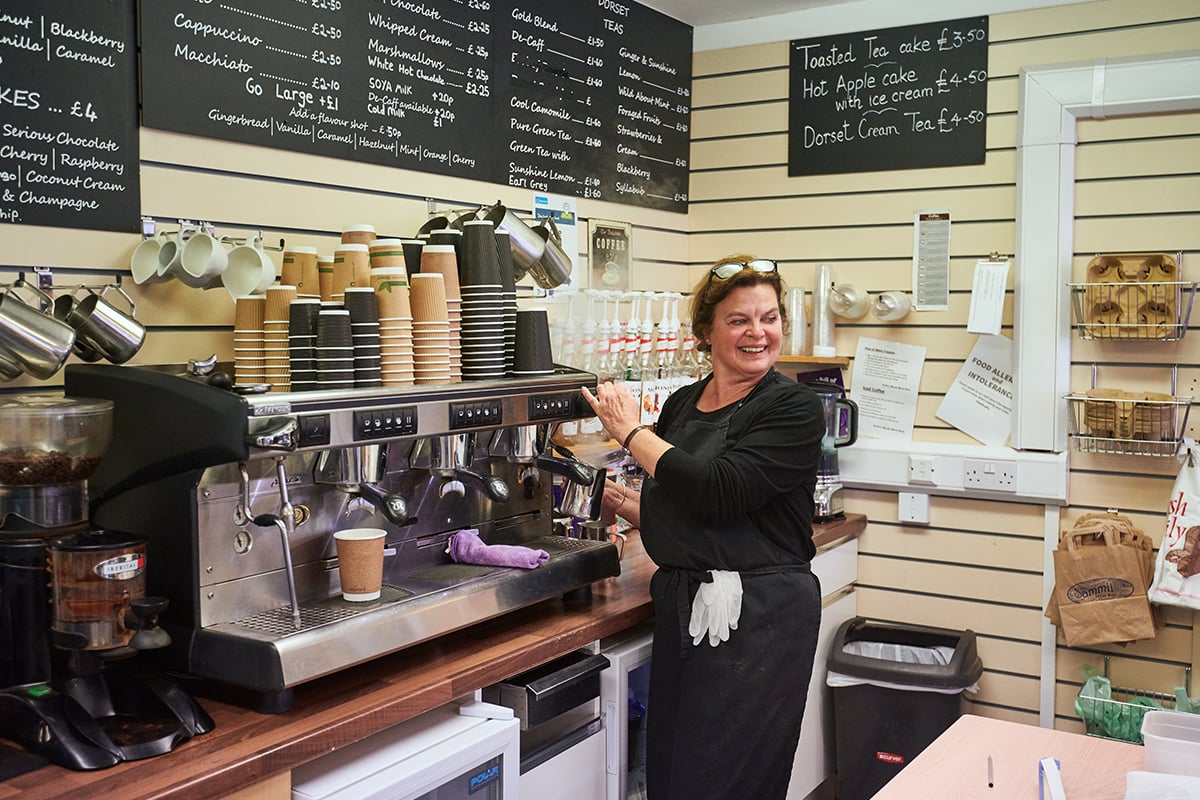 Older worker in cafe shop