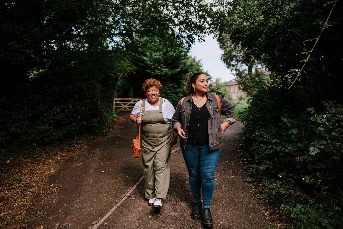 Older and younger people walking together