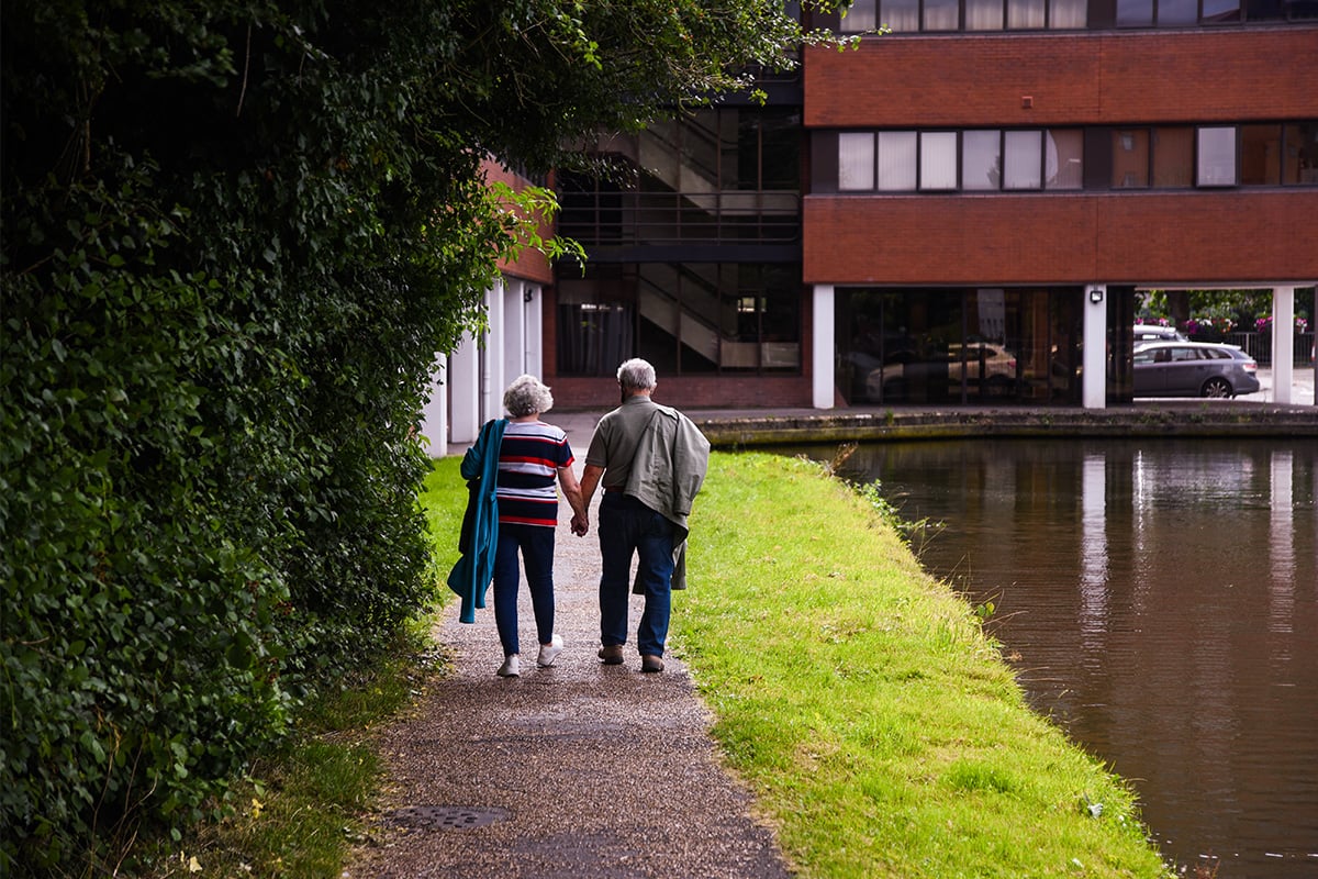 older couple walking outside