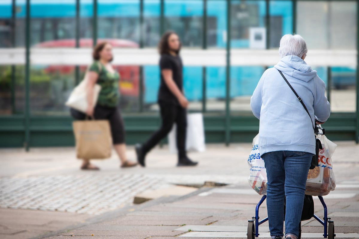 older woman walking down the street