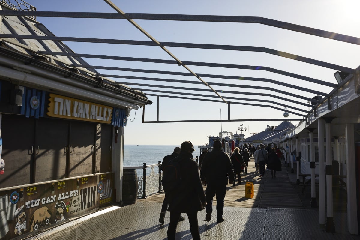 people walking on brighton pier