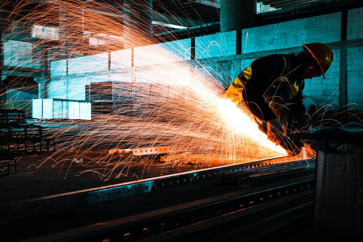 Worker uses welding machine