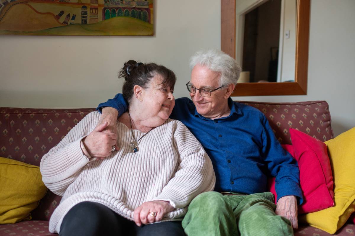 older couple sitting together on the sofa