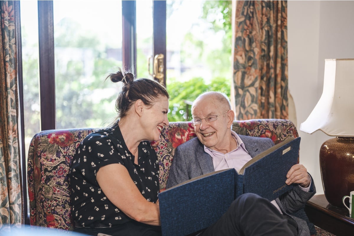 photo of woman caring for her father