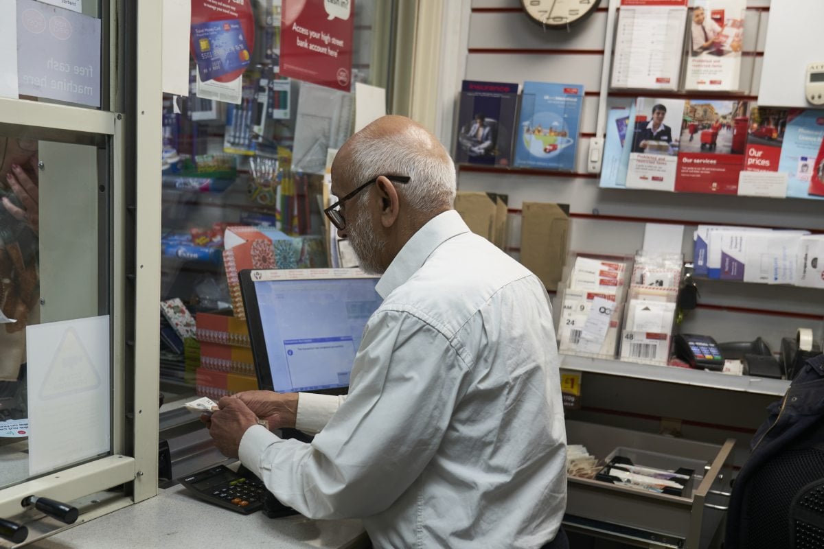 an older worker in the post office