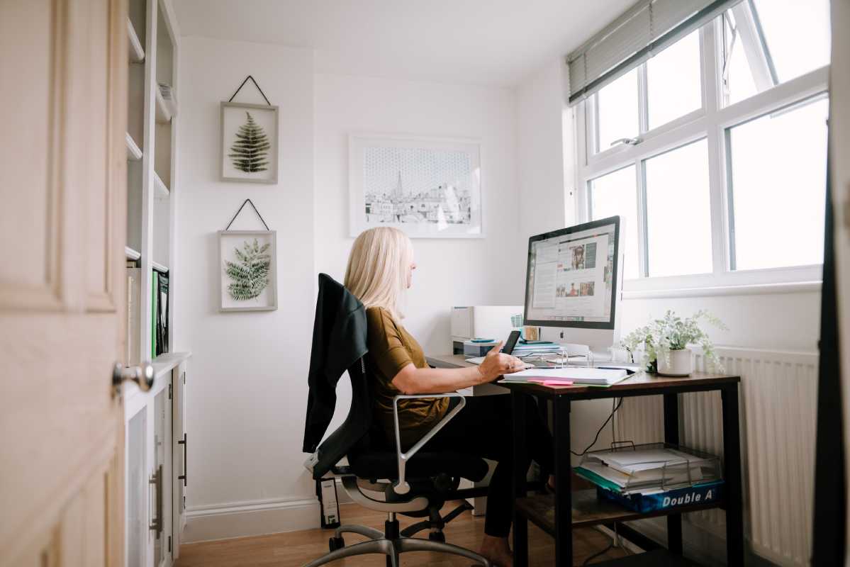 Blonde woman working at computer