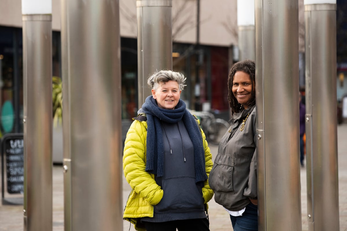 two women standing outside