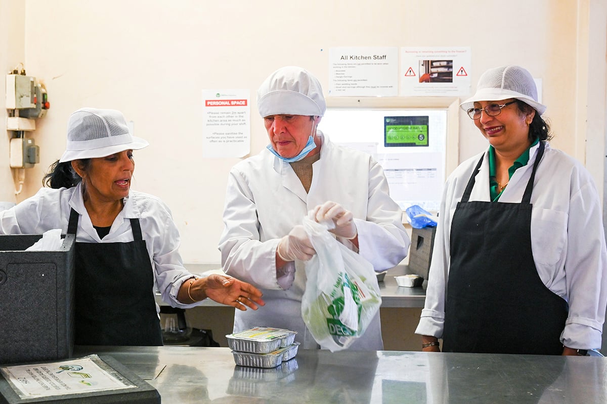 Older people working in a kitchen