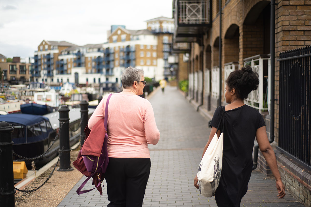 Two women walking down the street