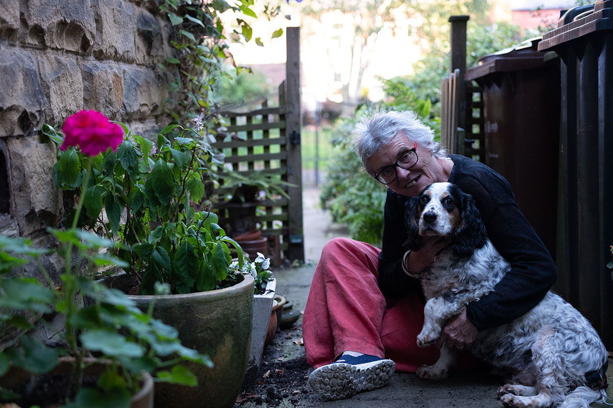 Older woman outside with a dog