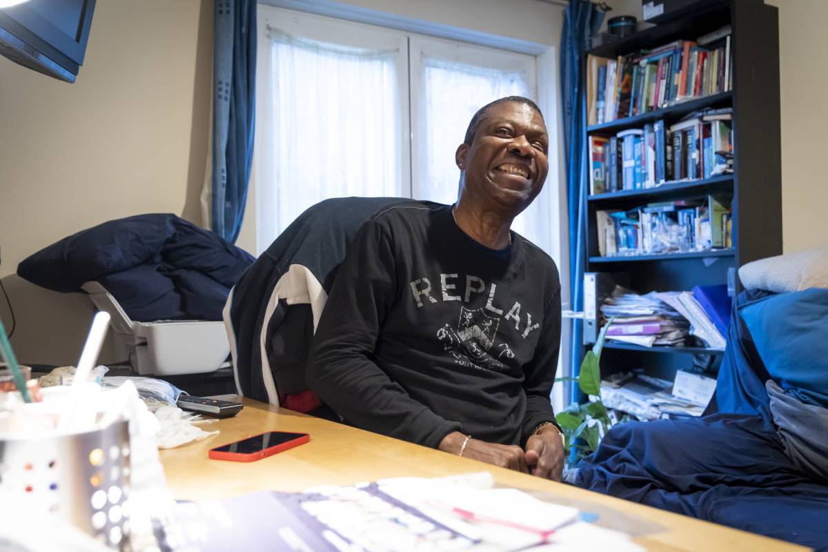Older man at home smiling