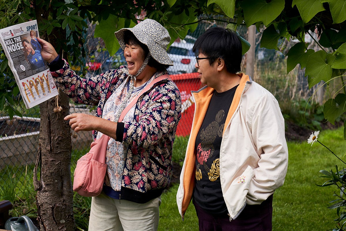 Two older women socialising outside