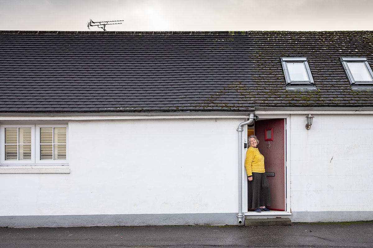 Older woman in house doorway