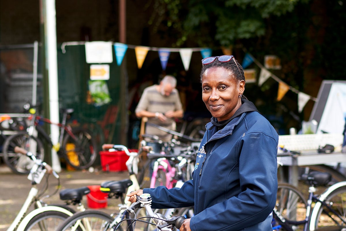 Older woman working with bikes