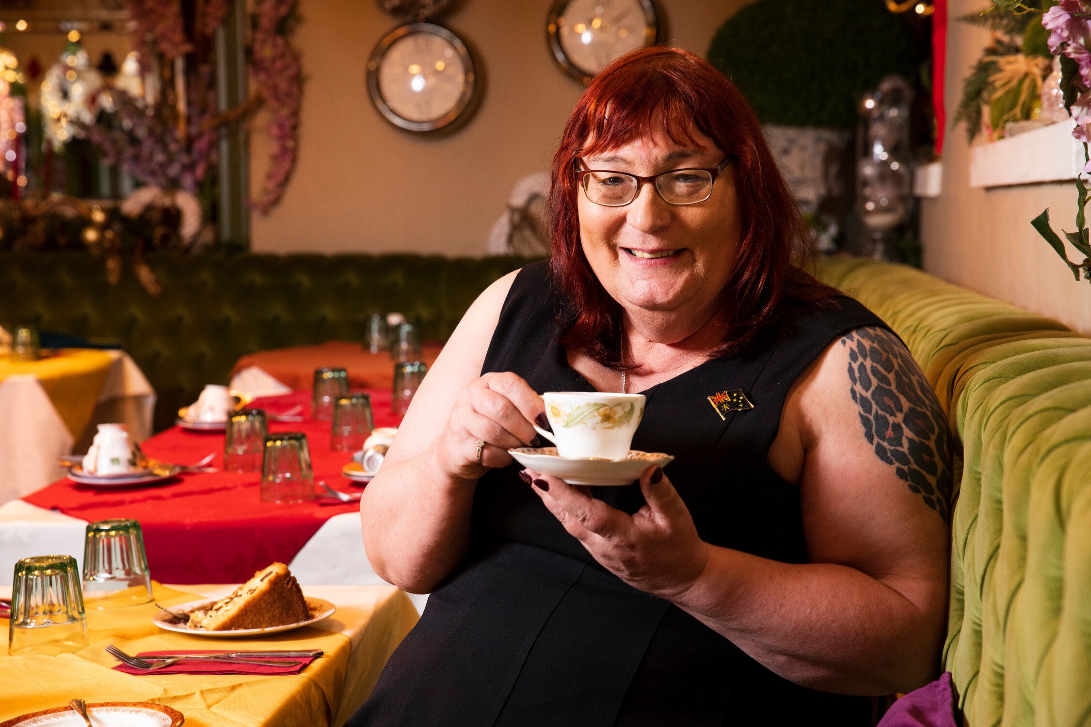 Older woman drinking a tea in a cafe