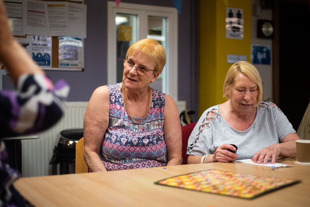 Older-women-socialising-at-a-table