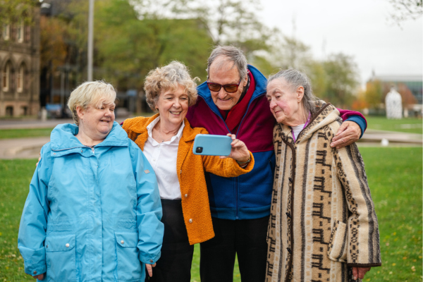A group of older people taking a selfie