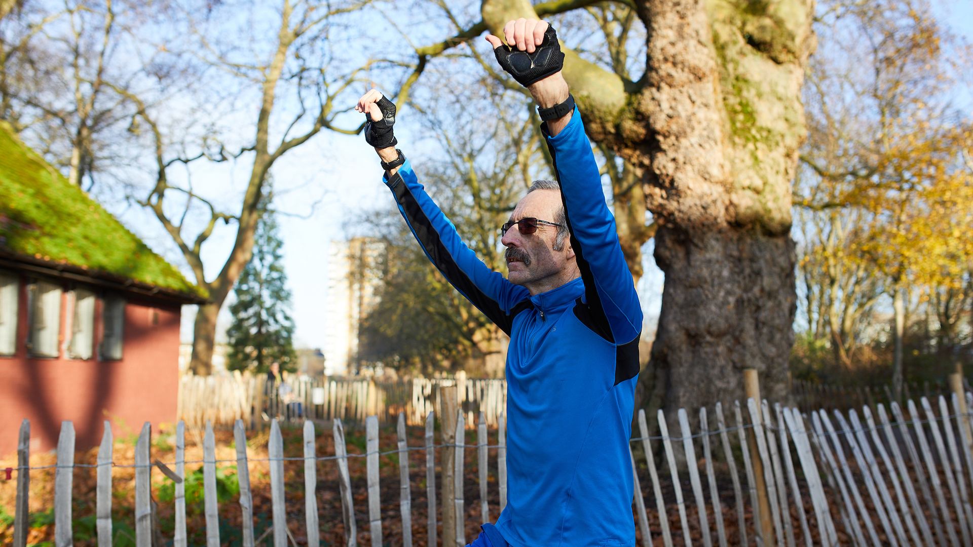 Man stretching in park