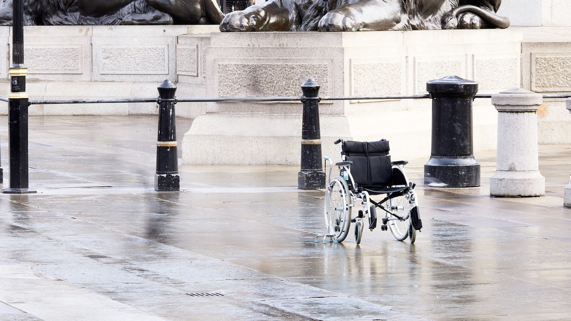 Empty wheelchair in street
