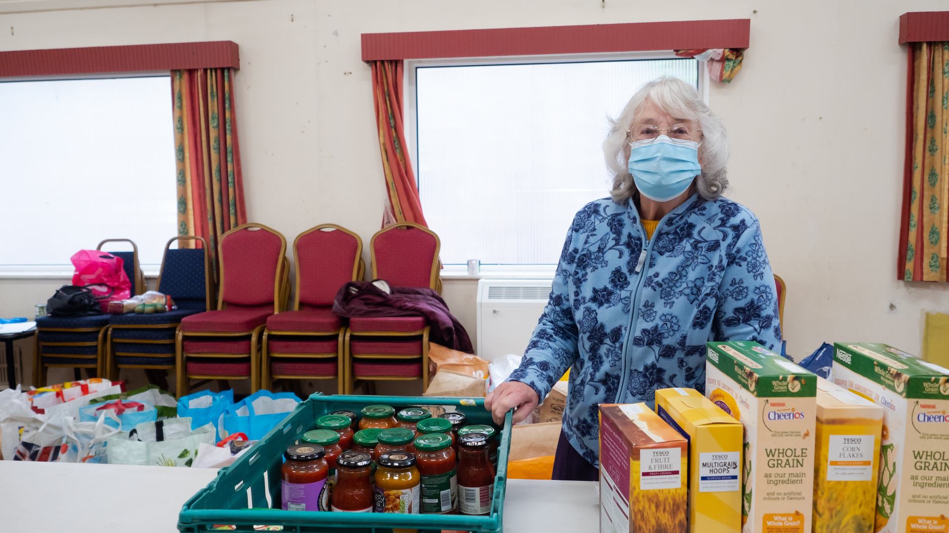 Older woman volunteering at a food bank