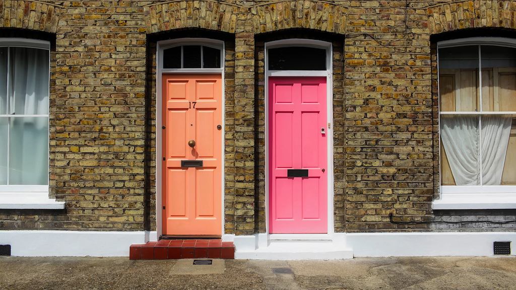 Terraced houses with orange and pink doors