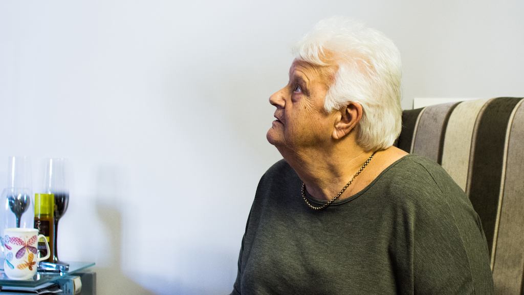 Woman sitting in armchair