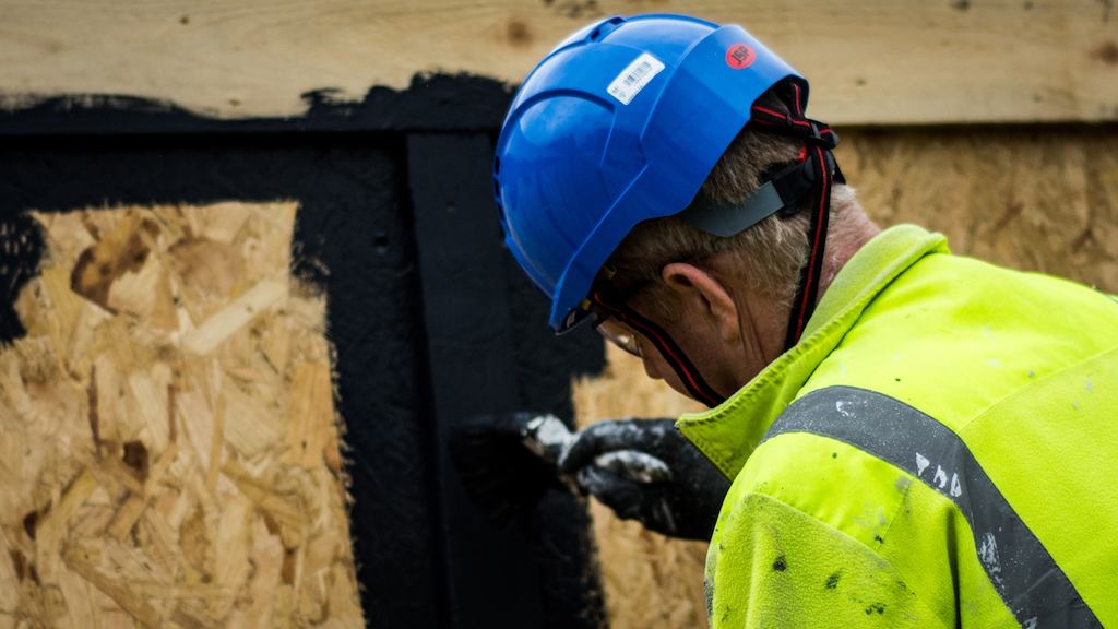 older worker wearing hard hat