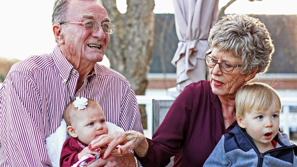 Older couple with young children