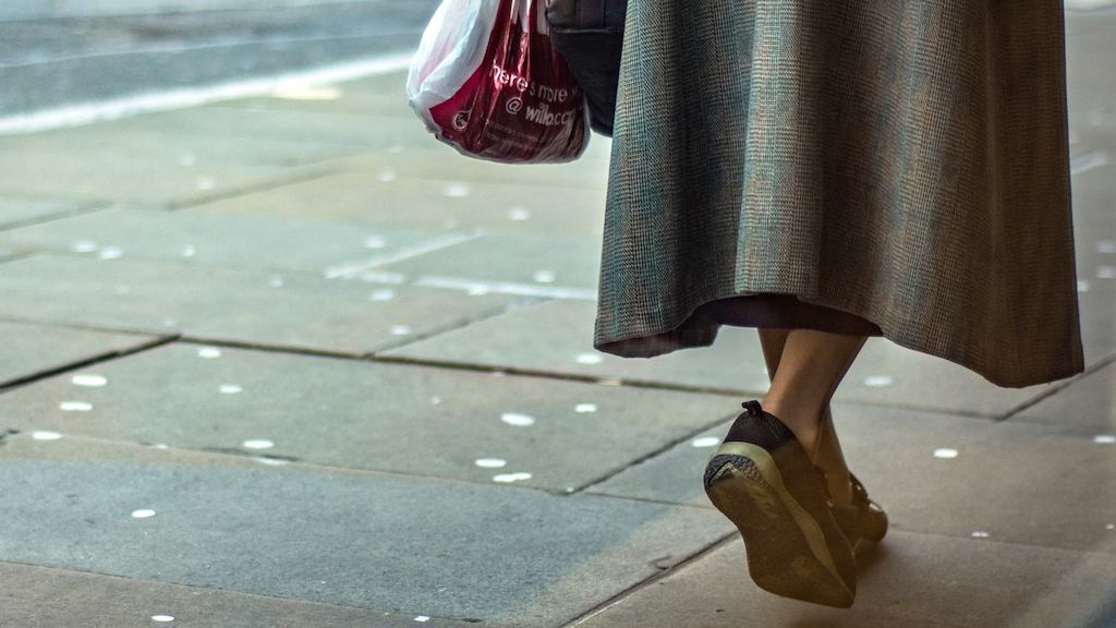 Woman walking along the street