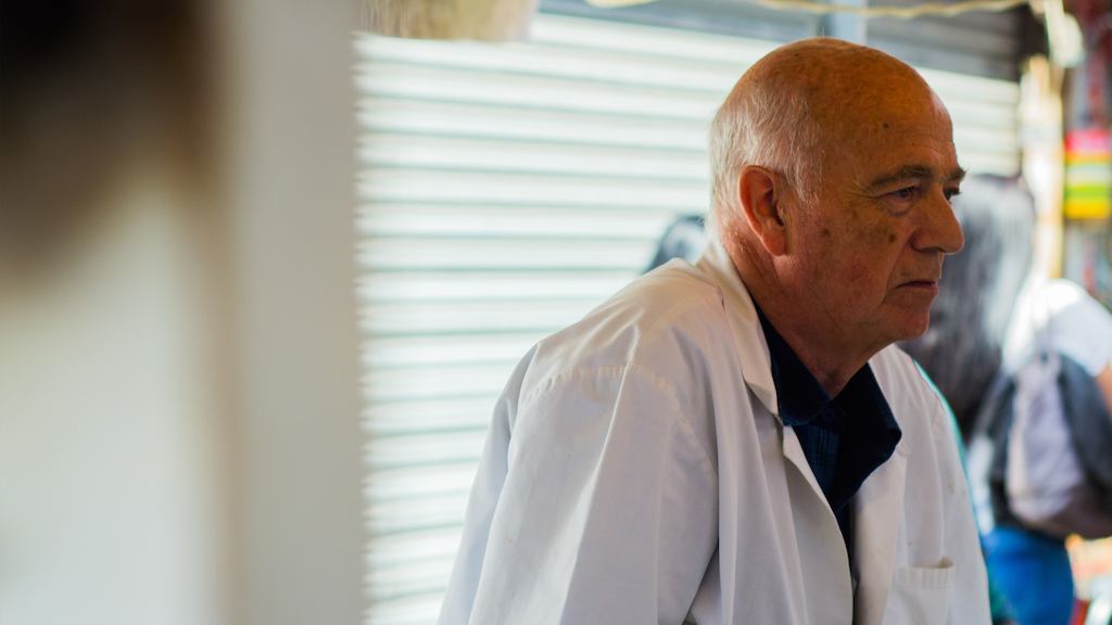 Older worker in market