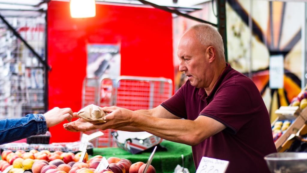 Man in the market selling fruit