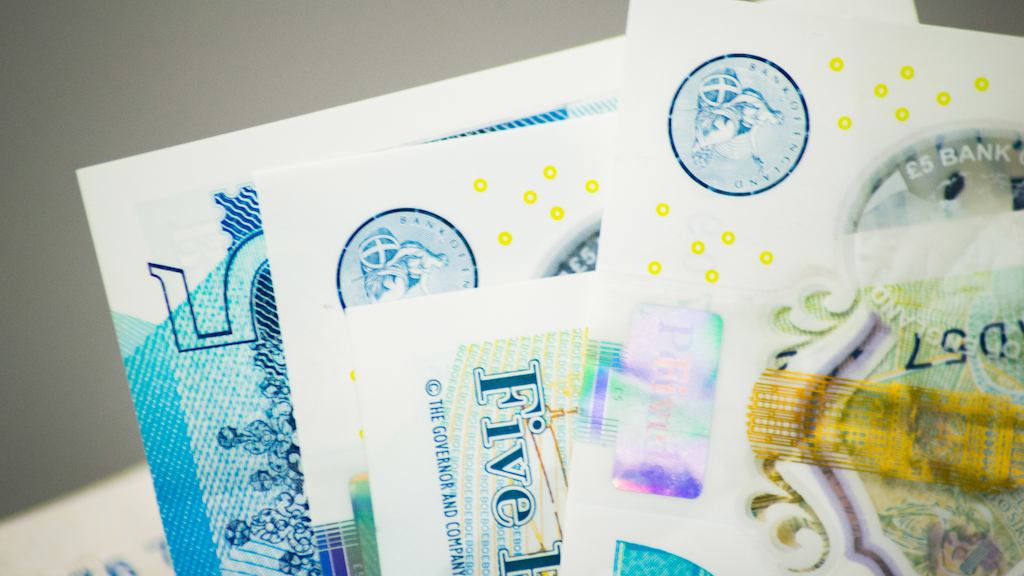 Five pound paper notes.