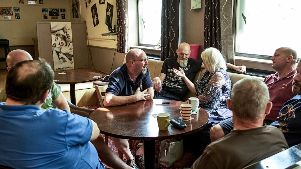 Group of people in mid-life sitting in a bar