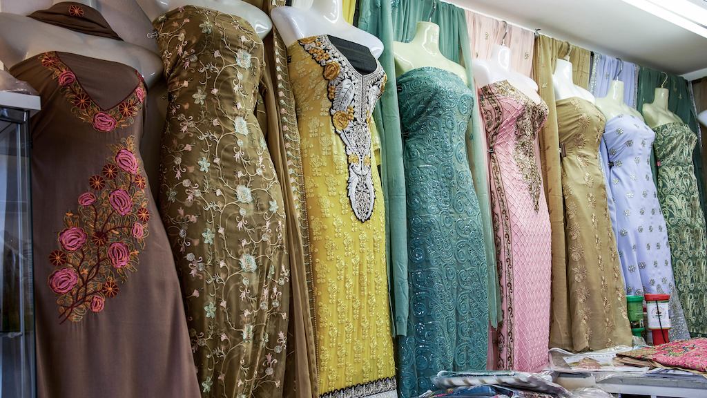 Collection of traditional East Asian dresses in a shop