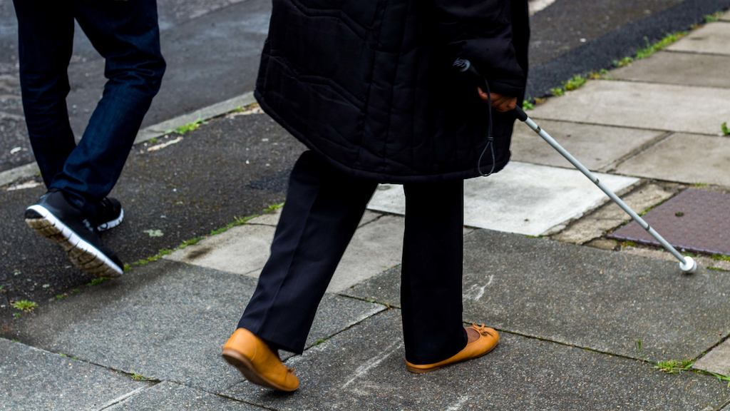 Person using walking stick