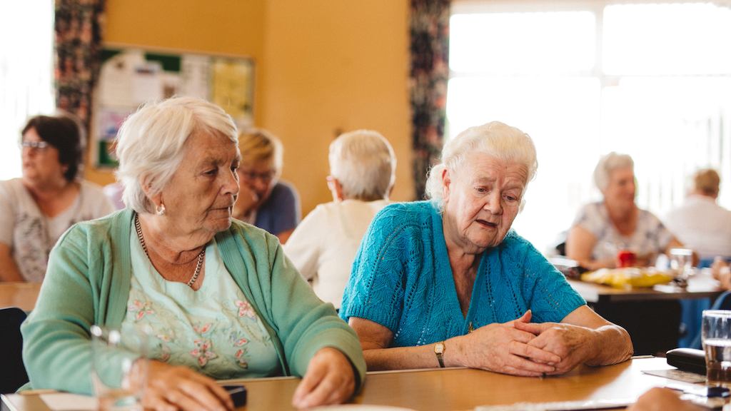 Older people playing dominoes