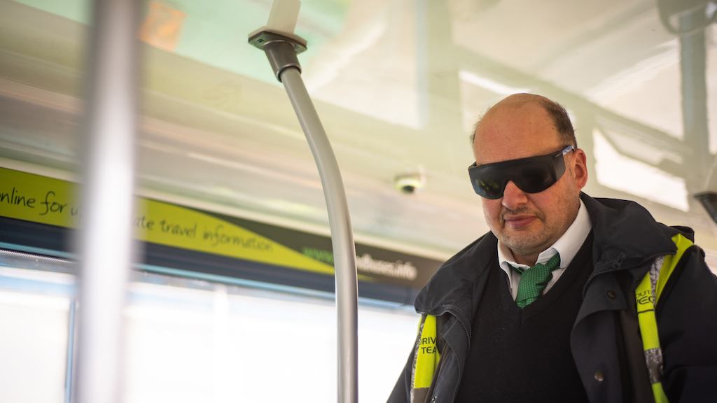 Man wearing visual impairment glassses