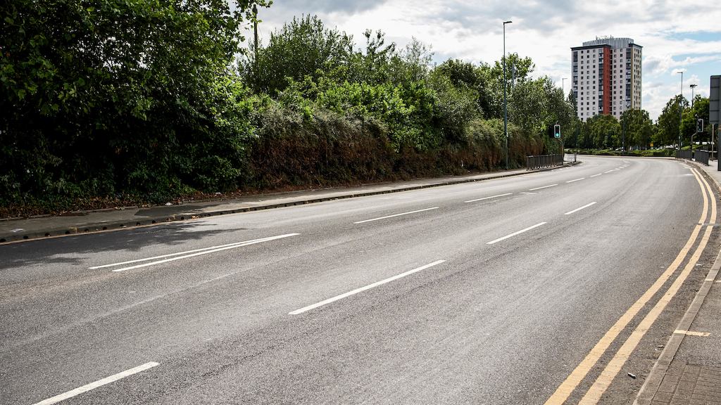 an urban road disappearing into the distance