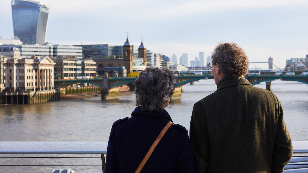 Older couple looking onto a river
