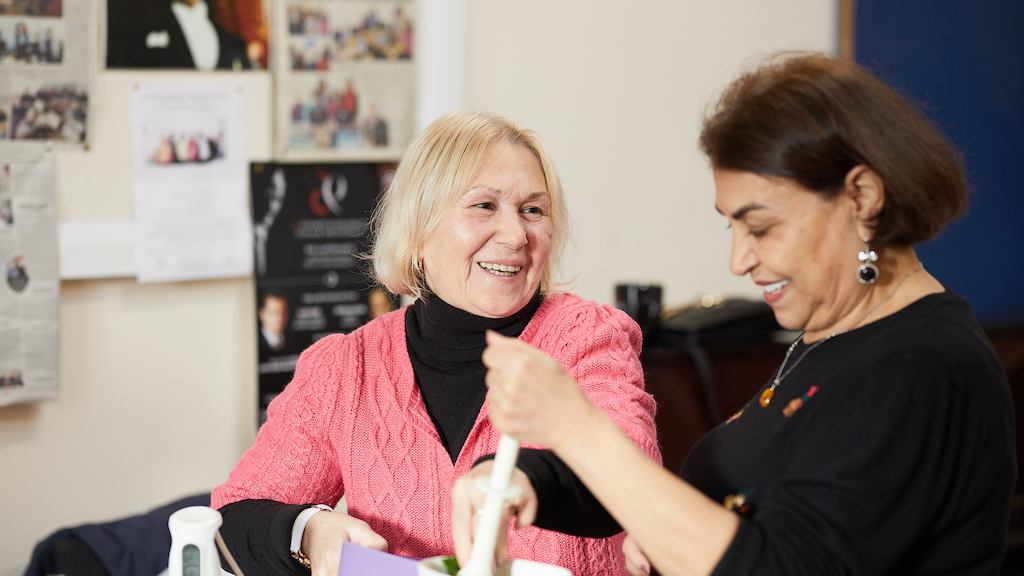 two women in a community cooking class