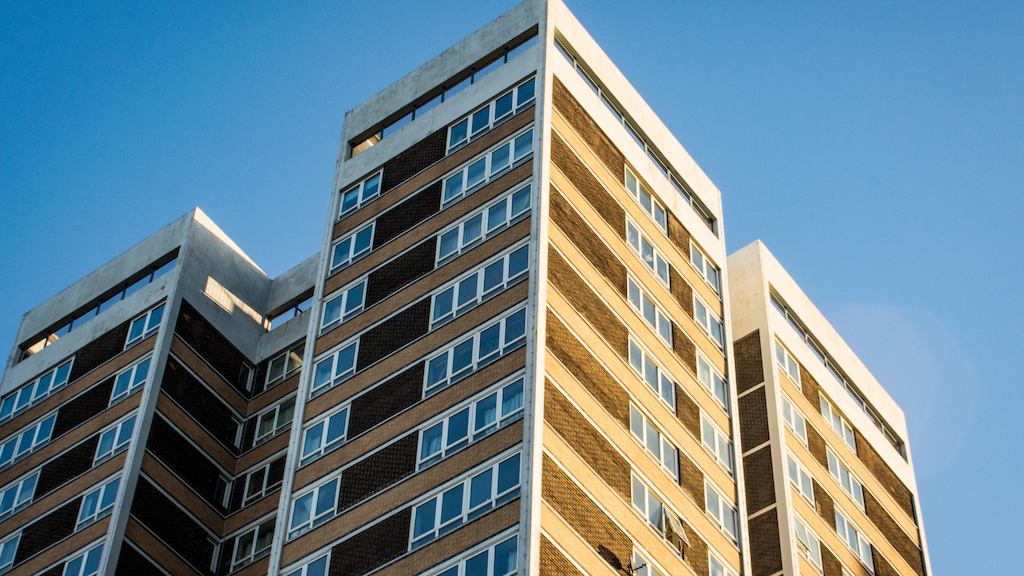 A group of high rise flats in the sunshine