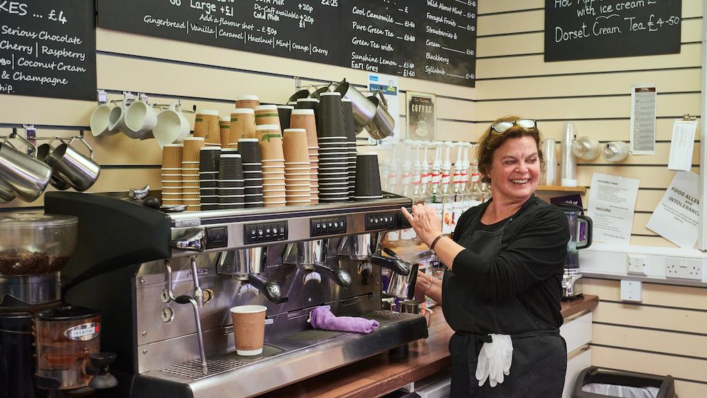 Older worker in cafe shop